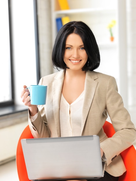 picture of happy woman with laptop computer