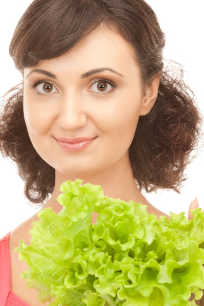 picture of happy woman with lettuce over white