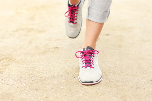 A picture of jogger's legs on sand