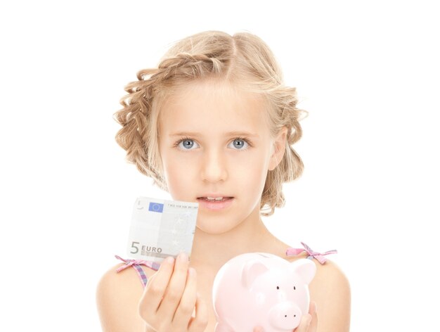 picture of little girl with piggy bank and money