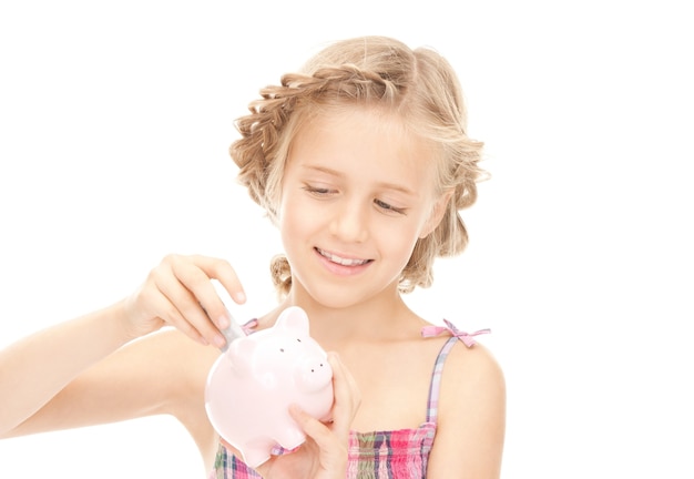 picture of little girl with piggy bank and money