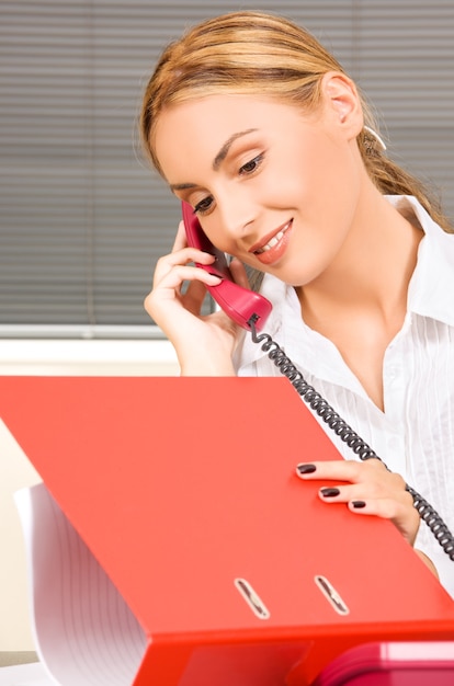 picture of lovely girl with phone in office