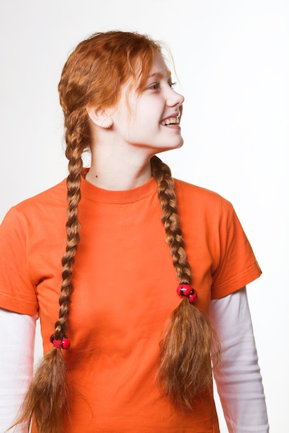 Photo picture of lovely redhead girl with long braids