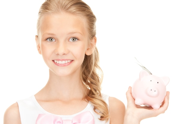 picture of lovely teenage girl with piggy bank and money