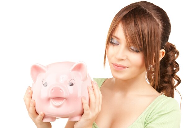 picture of lovely teenage girl with piggy bank