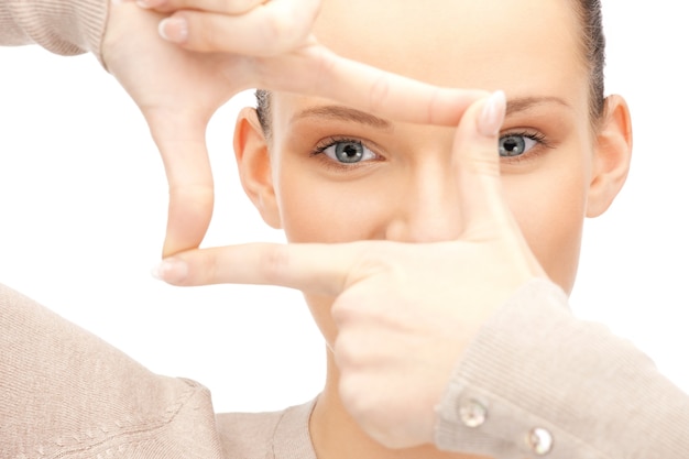 picture of lovely woman creating a frame with fingers