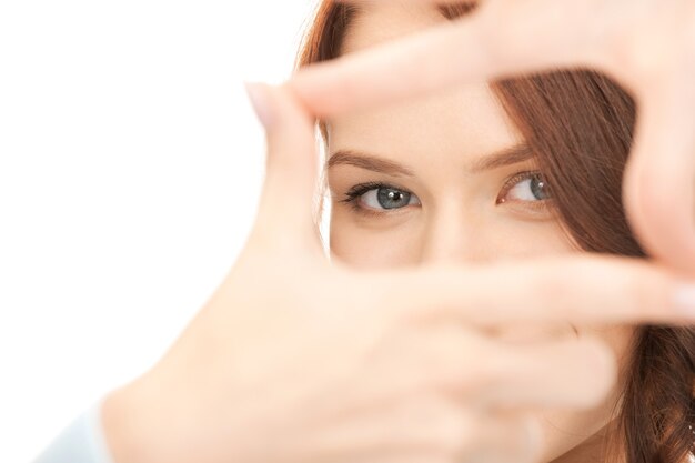 picture of lovely woman creating a frame with fingers