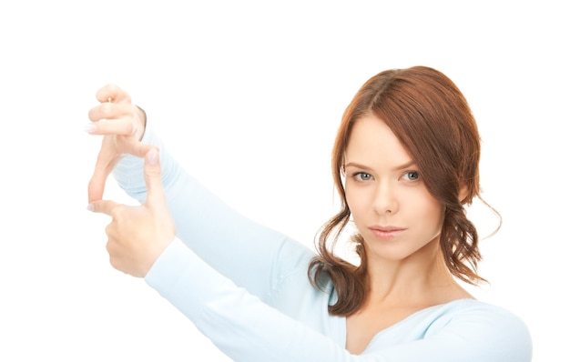 picture of lovely woman creating a frame with fingers