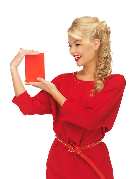 ノートカードと赤いドレスを着た素敵な女性の写真