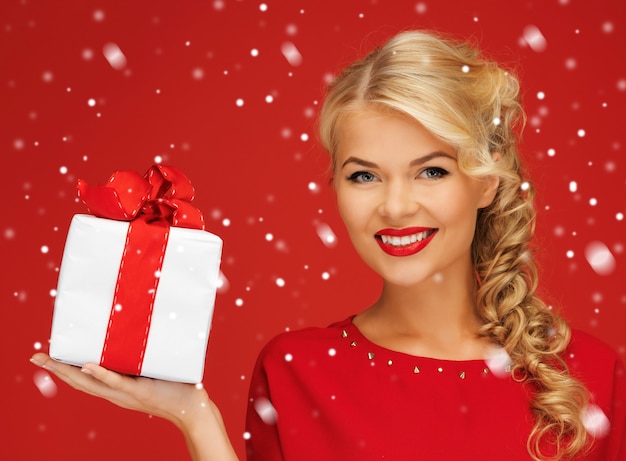 picture of lovely woman in red dress with present