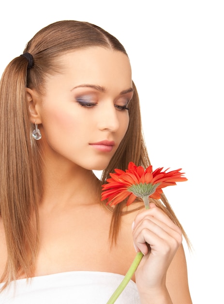 picture of lovely woman in towel with red flower