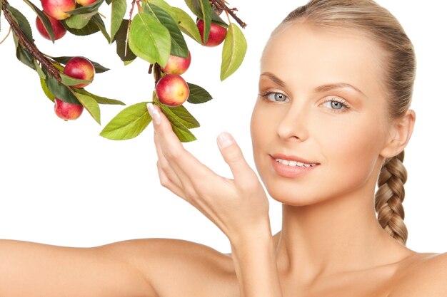 picture of lovely woman with apple twig