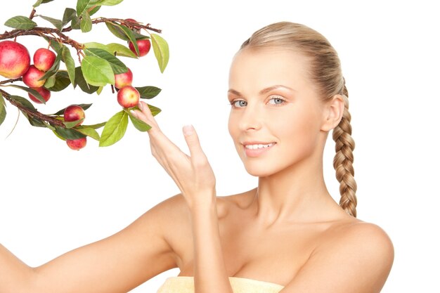 picture of lovely woman with apple twig