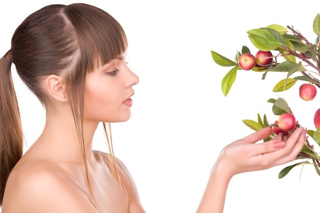 picture of lovely woman with apple twig