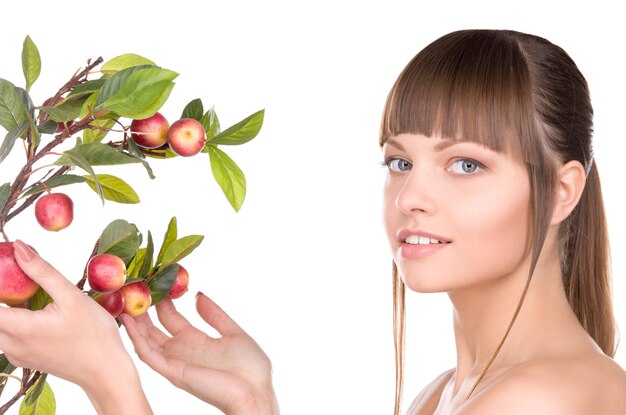 picture of lovely woman with apple twig