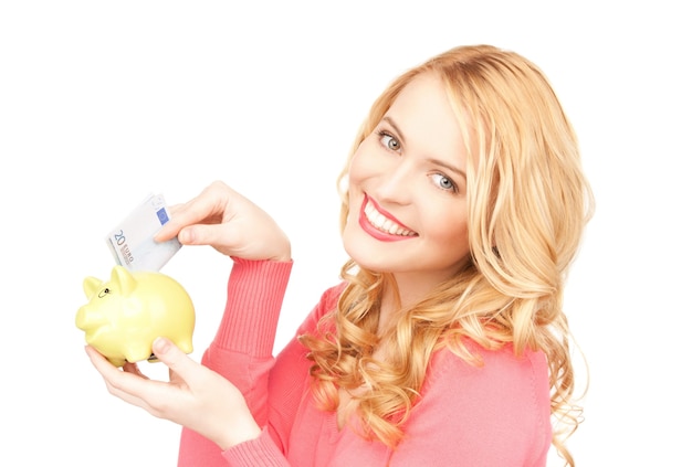 picture of lovely woman with piggy bank and money