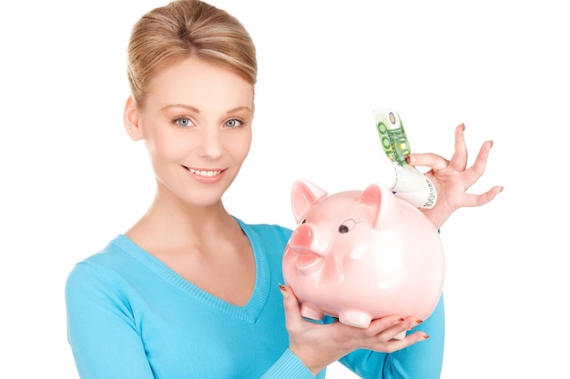 picture of lovely woman with piggy bank and money