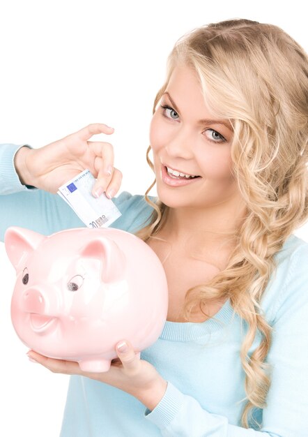 picture of lovely woman with piggy bank and money