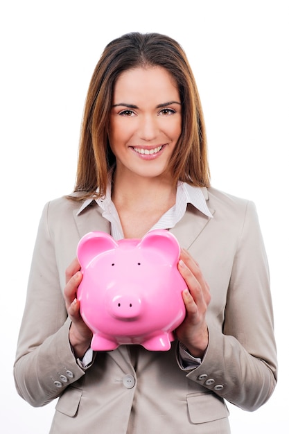 Picture of lovely woman with piggy bank