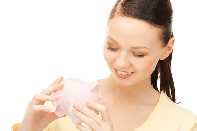 picture of lovely woman with piggy bank