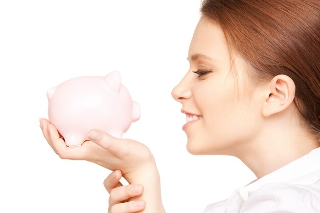 picture of lovely woman with piggy bank