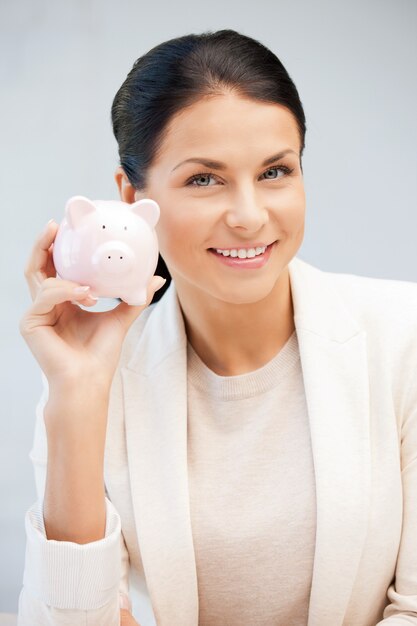 picture of lovely woman with piggy bank