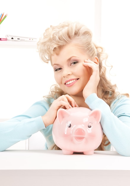 picture of lovely woman with piggy bank