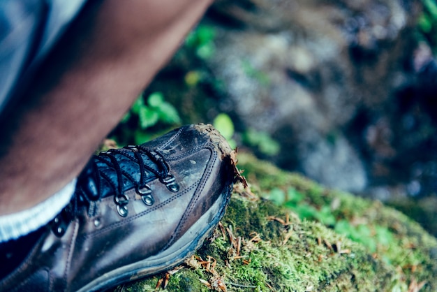 Picture of man shoes standing on the rock