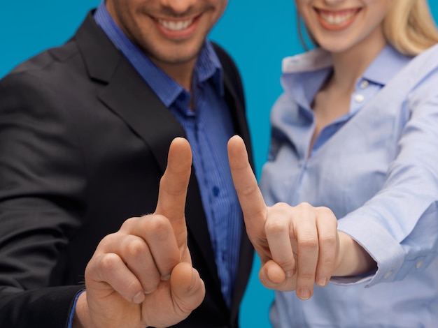 picture of man and woman hands pointing at something