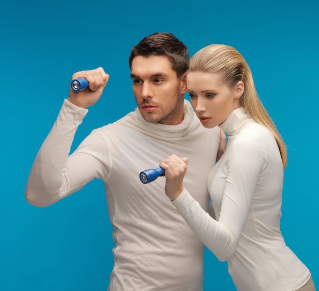 picture of  man and woman with pocket flashlights