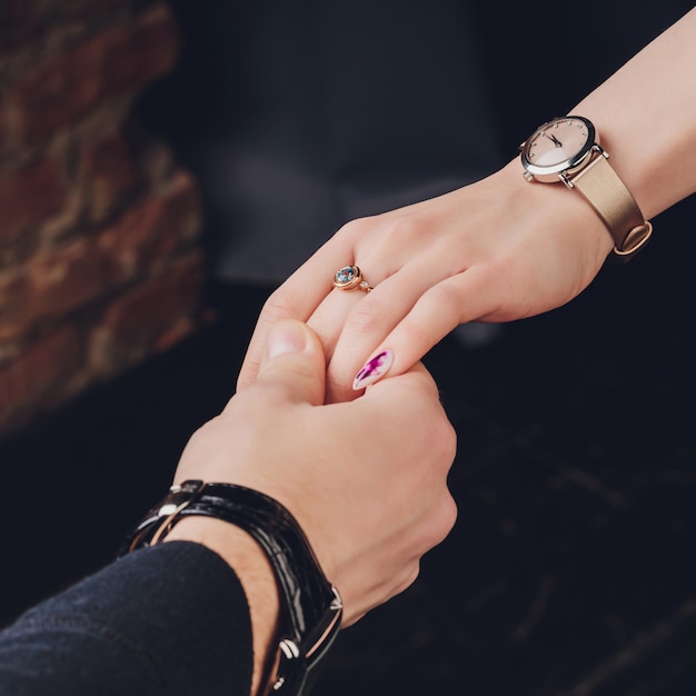 Picture of man and woman with wedding ring.