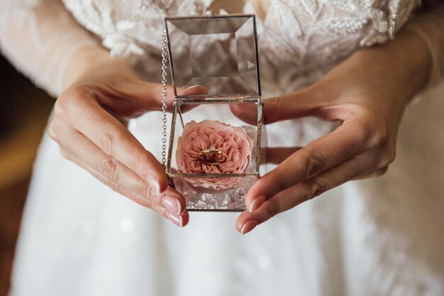 Picture of man and woman with wedding ringYoung married couple holding hands ceremony wedding day Newly wed couple's hands with wedding rings