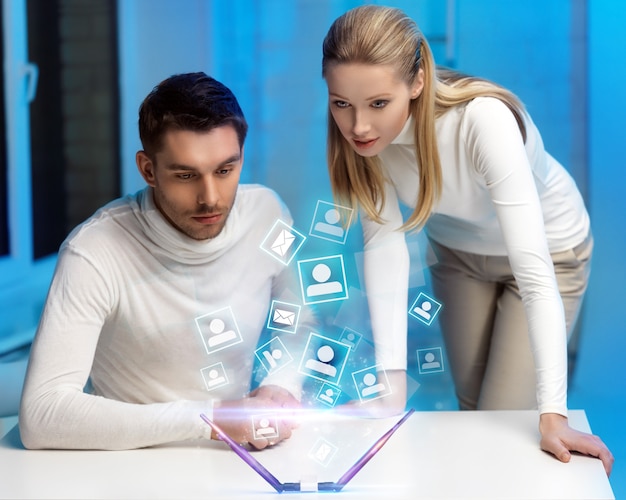 picture of man and woman working with virtual screen