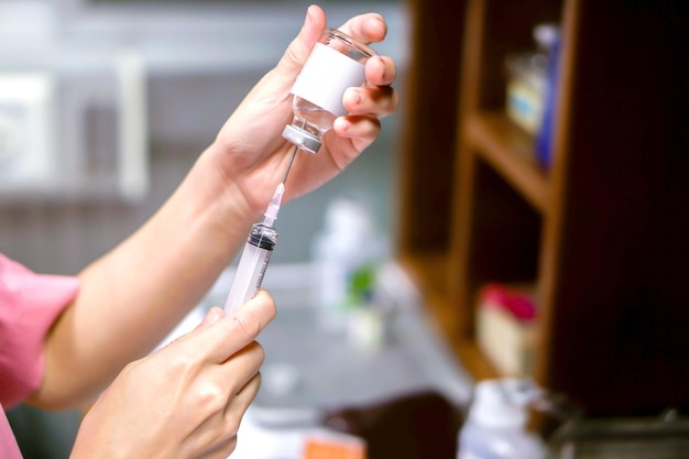 A picture of nurse hands in preparation an injection vaccine for the patient