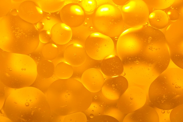 Picture of oil on the surface of the water golden color similar to serum for skin care