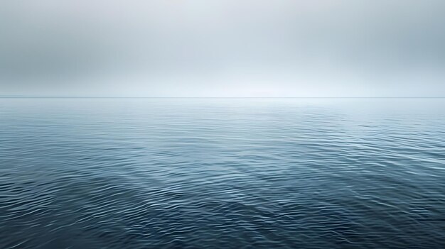 a picture of a sea with a blue sky and the ocean in the background