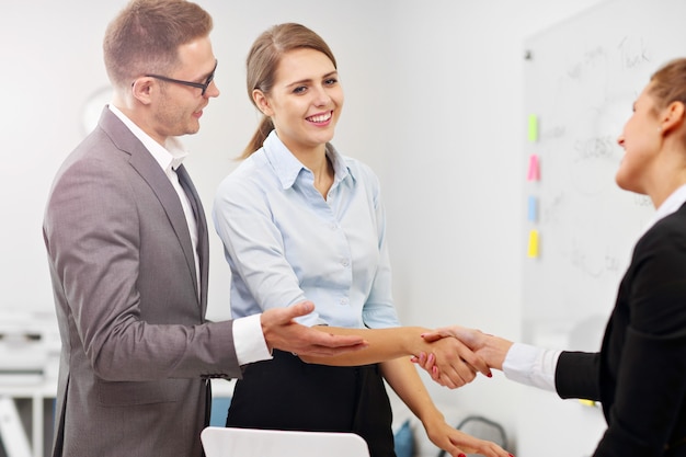 Picture showing manager introducing new worker to the team