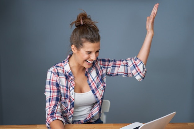 Photo picture showing successful female student learning at home