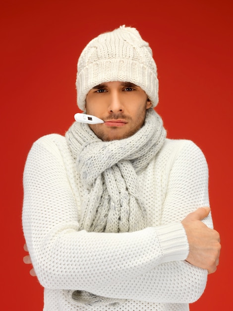 picture of sick man with thermometer in his mouth