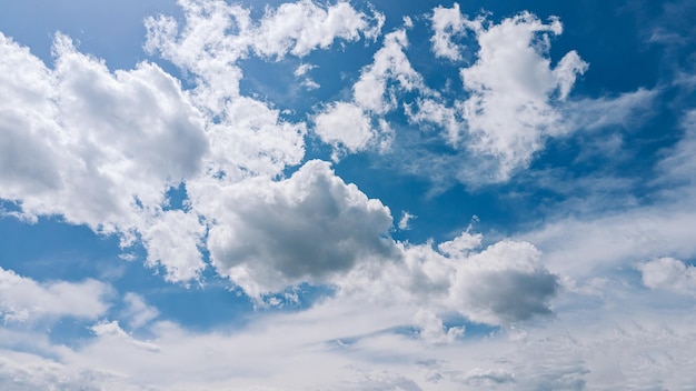 A picture of a sky with clouds and a plane in the sky.