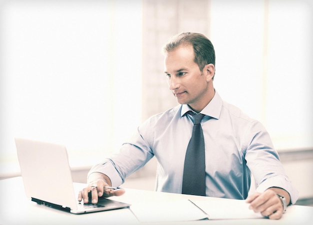 picture of smiling businessman working in office