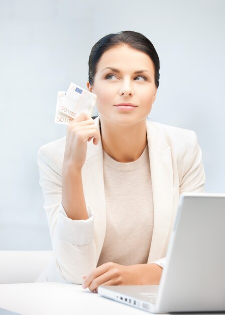 picture of smiling businesswoman with cash money