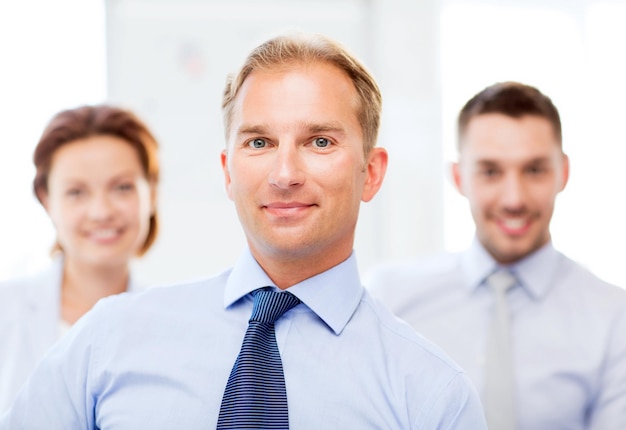 picture of smiling handsome businessman in office