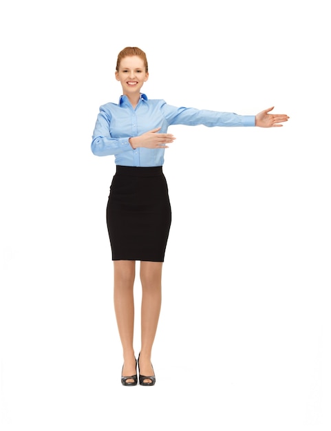 picture of smiling stewardess showing direction