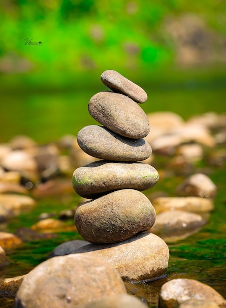 A picture of a stack of rocks with the word zen on it