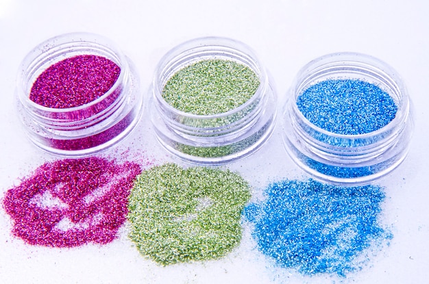 Picture of three different kinds of nail glitters.