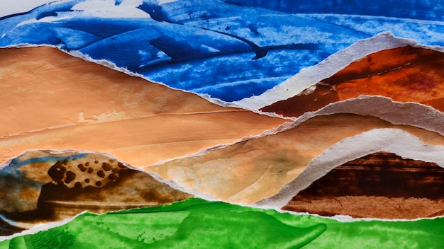 Picture of torn paper cut and pasted colorful mountain ranges