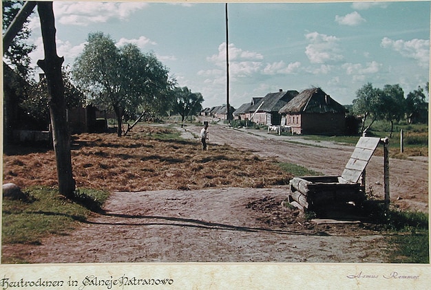 a picture of a town with a sign that says  the word  on it