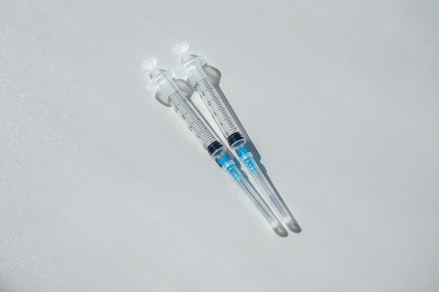 Picture of two syringes on the table