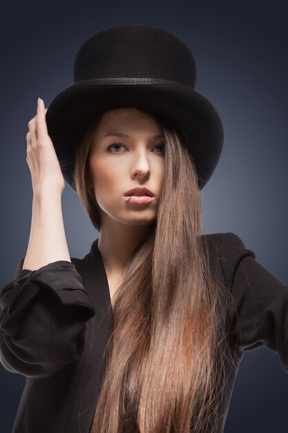 picture of woman in black jacket and top hat